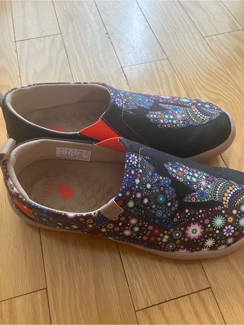UIN Black Slip-On Sneakers with Multicolor Floral Mandala Print